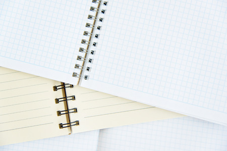 open notebook on a wooden background. Open net note pad with a pen on a gray table