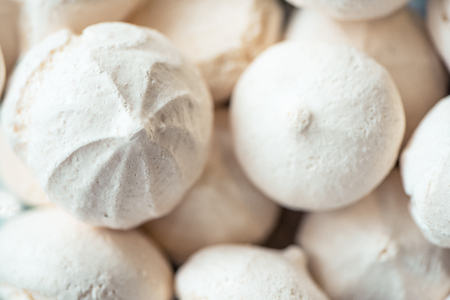 Closeup of mini meringues on white as food background. homemade foodの写真素材