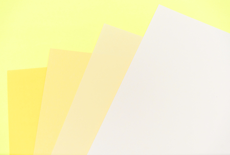 Abstract pastel colored paper texture minimalism background. Minimal geometric shapes and lines in yellow colours.の写真素材