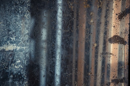 Cracks, stains and dust on the mirror makes a grunge texture. The concept of past time, memories. Retro background.の写真素材