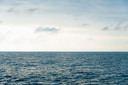 View from cabin balconies at the rough seas and waves off the side of cruise ship. Seascape picture. The sky with clouds, not big waves on sea surface. Excitement at seaの写真素材