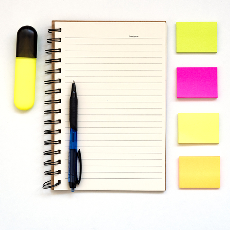 Note paper, open notepad, blank multi-colored paper blocks for notes on a white background, pen,...