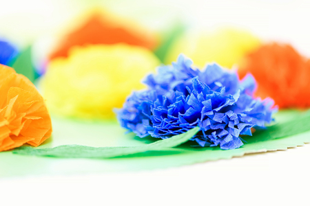Abstract background of the flowers of colored paper closeup shot. Selective soft focus. Blurred colorful background.の写真素材