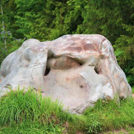 Structure of surface of the stone, used as background. Stone texture. Natural rocks Smooth texture of a big boulder close up.の写真素材