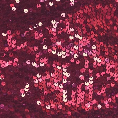 Background sequin. Holiday abstract glitter background with blinking lights. Fashion fabric sequins...