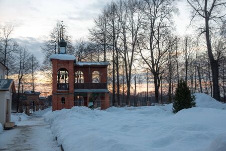 Winter landscape, Russian nature, early morning in the monastery, dawn pink light.の写真素材