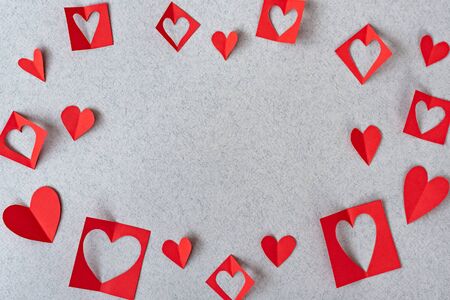 Red heart background Romantic Valentines in love sweet. Red paper hearts on grey textured paper backgrounds. Love and Valentine's day concept.の写真素材