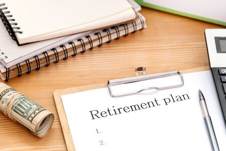Word writing text Retirement Plan on white papaer on desk. Business concept for Savings Investments that provide incomes for retired workers.の写真素材