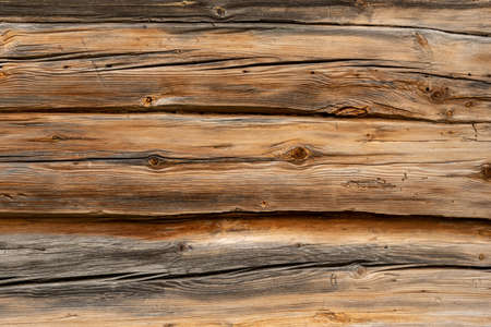 Wooden table surface with weathered boards at sunlight