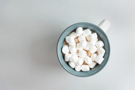 Cup of coffee with marshmallows, top copy spaceの写真素材