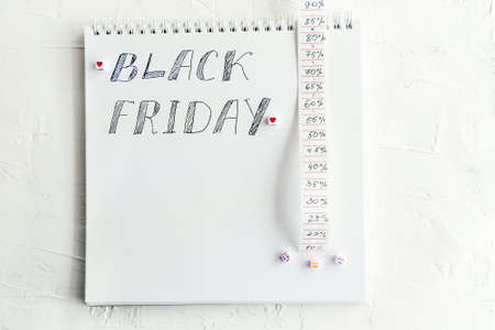 Words Black Friday and strip with discount percent on whiteの写真素材