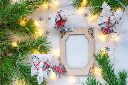 Christmas wooden frame decorated pine branches on whiteの写真素材