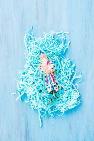 Bright decor and glass toy on light backdrop