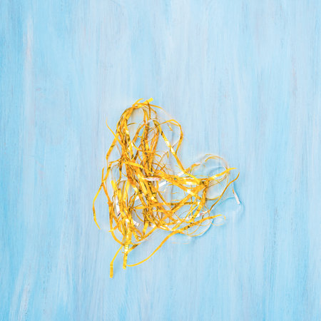 Golden metal foil or tinsel decorationの写真素材