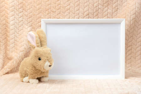 Stuffed animal toy bunny and white frame mockup