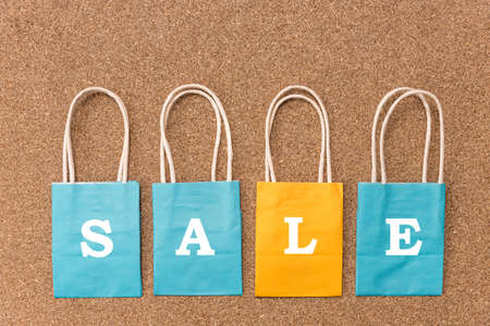 Special sale and black friday festival concepts with text on colorful shopping bag on wooden...