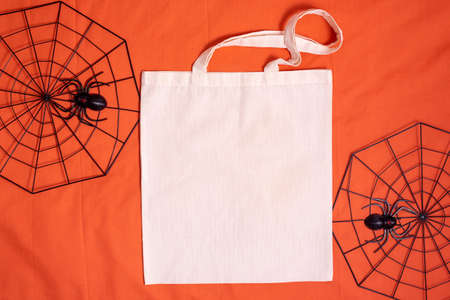 White mock up tote bag canvas fabric on halloween decor