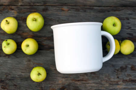 Mug mockup and apples flat lay on woodenの写真素材