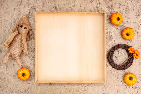 Fall wooden frame with copyspace and pumpkinの写真素材