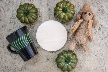 Jack straws pumpkins mug and blank round board on plywoodの写真素材