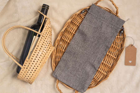 Flat lay simple mockup gray wine bag and wine bottle.の写真素材