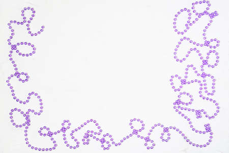 Christmas white background with frame of Christmas decorations beads.の写真素材