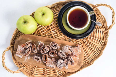 Sweet pastille of apples in rolls with tea.