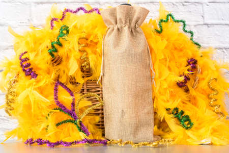 Empty blank wine gift bag on table. Mardi Gras party Mock up