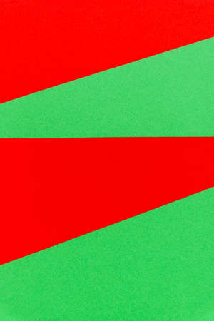 Abstract with red on green sheets vertical background. Natural bright color paper texture backdrop. Christmas empty space texture.の写真素材