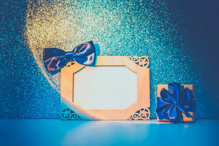 Blank for designers with an ancient carved frame on a blue sparkling backgroundの写真素材