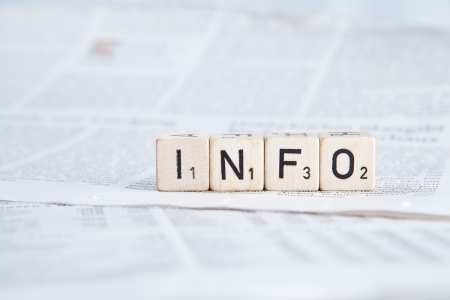 Dice on newspaper - infoの写真素材