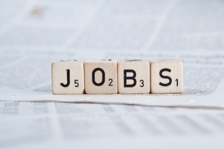Dice on newspaper - Jobsの写真素材