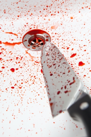 Bloody knife in the sinkの写真素材