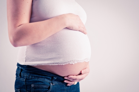Woman holds babybelly