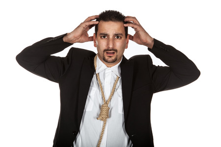 Suicidal businessman with a rope nosse around his neckの写真素材