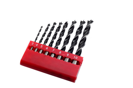 Set drill bits in box in white isolated background.の写真素材