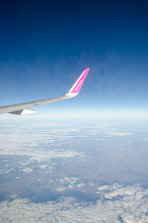 Kyiv, Ukraine - December 13, 2017:  Wing of an airplane in a flight of low-cost air carrier Wizz Airのeditorial素材