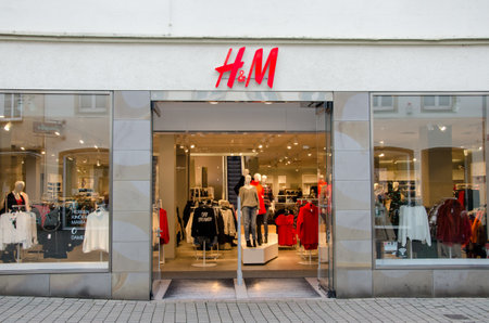 Soest, Germany - December 18, 2017: H&M sign on the wall. H&M Hennes & Mauritz AB is a Swedish...