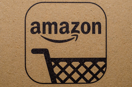 Soest, Germany - December 19, 2017: The Amazon Logo on cardboard envelope. Amazon.com, Inc., is an...