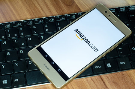 Soest, Germany - January 4, 2018: Amazon logo on screen of Huawei P9 lite. Amazon is an American...