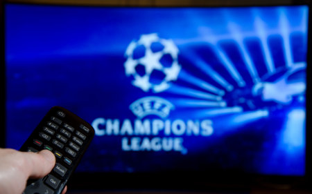 Soest, Germany - January 14, 2018: Man watching UEFA Champions League on TV. The UEFA Champions League is an annual continental club football competition.のeditorial素材