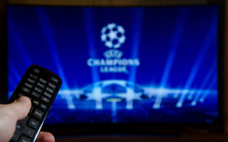 Soest, Germany - January 14, 2018: Man watching UEFA Champions League on TV. The UEFA Champions League is an annual continental club football competition.のeditorial素材