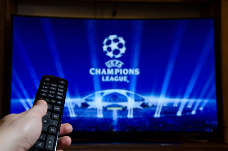 Soest, Germany - January 14, 2018: Man watching UEFA Champions League on TV. The UEFA Champions League is an annual continental club football competition.のeditorial素材