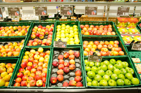 Soest, Germany - December 17, 2018: Fresh apples on shelf in HIT supermarket.のeditorial素材
