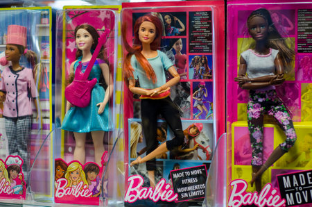 Soest, Germany - December 22, 2018: Barbie Toys for sale in the Supermarket Stand. Barbie is a fashion doll manufactured by the American toy company Mattel, Inc. and launched in March 1959.のeditorial素材