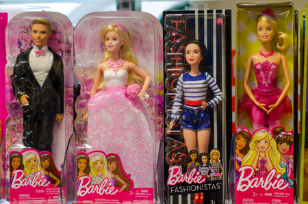 Soest, Germany - December 22, 2018: Barbie Toys for sale in the Supermarket Stand. Barbie is a fashion doll manufactured by the American toy company Mattel, Inc. and launched in March 1959.のeditorial素材