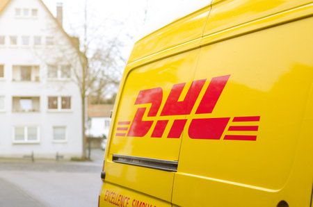 Soest, Germany - January 3, 2019: DHL car parked in the street. DHL is the global market leader in the logistics industry.のeditorial素材