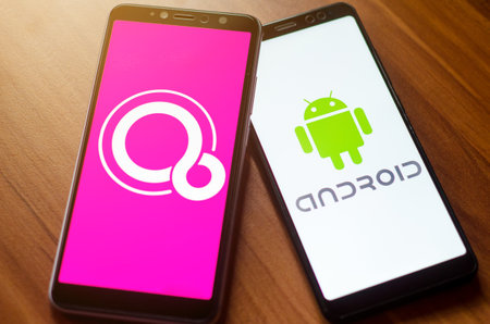 Soest, Germany - January 7, 2019: Google Fuchsia OS and Android logo on screen Xiaomi phones.のeditorial素材