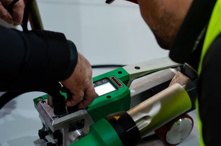 Kyiv, Ukraine - March 20, 2019: Using Leister UNIROOF AT. The new UNIROOF AT automatic roof welding machine.のeditorial素材