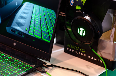 Kyiv, Ukraine - April 12, 2019: Close-up of HP laptop and headphones.のeditorial素材